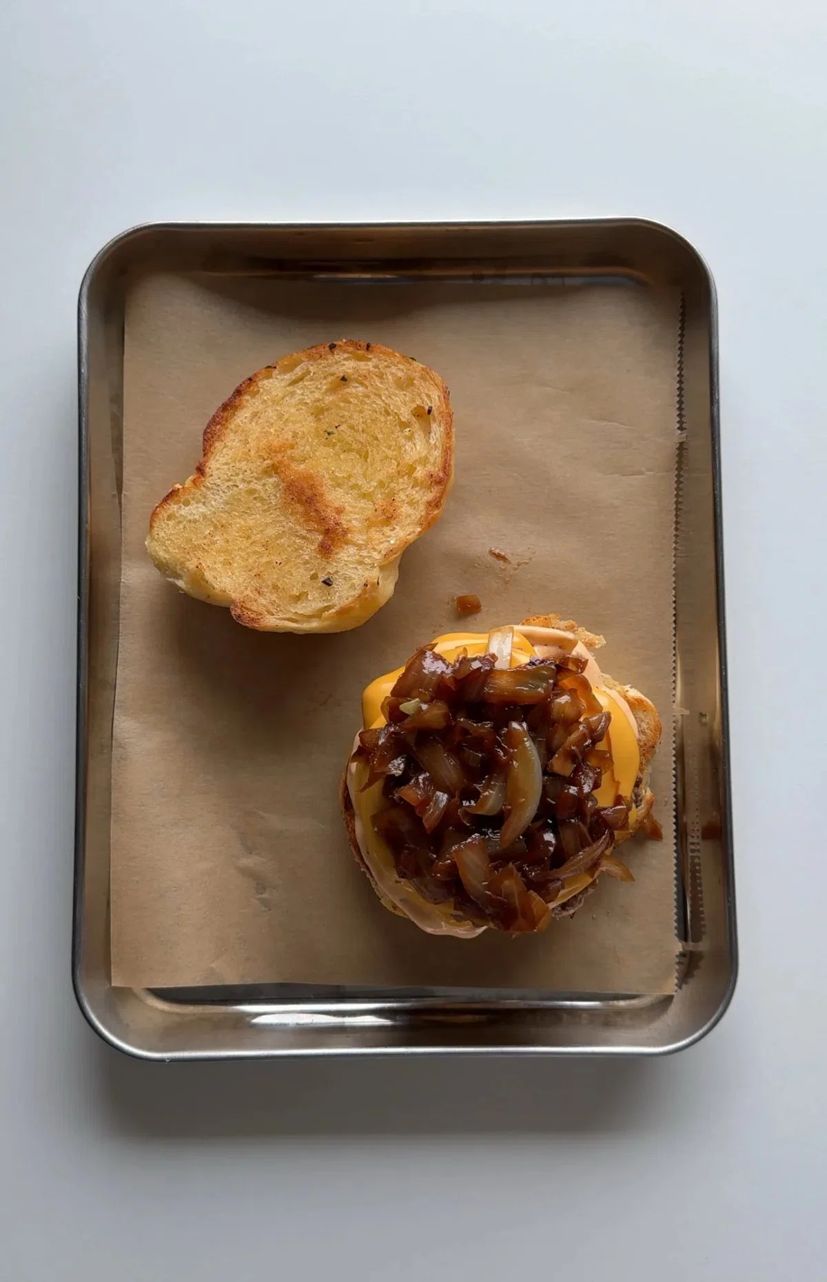 Garlic Knot Double Smash Burger with Caramelized Onion and Chipotle Sauce