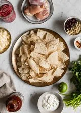 BBQ Chicken Nachos With Cilantro-Lime Crema