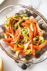 Air-Fryer Sausage Dogs with Peppers and Onions