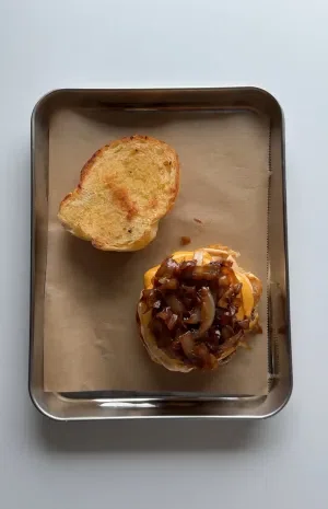 Garlic Knot Double Smash Burger with Caramelized Onion and Chipotle Sauce