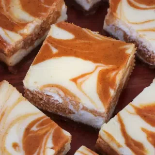 The Best Pumpkin Swirl Cheesecake Bars
