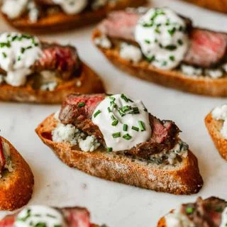 Steak Crostini with Blue Cheese & Garlic Sauce