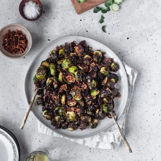 Crispy Brussels Sprouts With Fried Shallots, Bacon, & Dijon Vinaigrette
