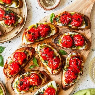 Baked Caprese Crostini with Pesto