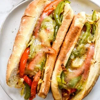 Air-Fryer Sausage Dogs with Peppers and Onions