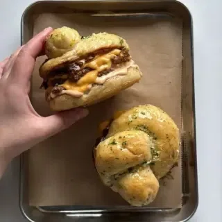 Garlic Knot Double Smash Burger with Caramelized Onion and Chipotle Sauce