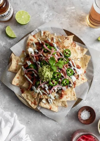 BBQ Chicken Nachos With Cilantro-Lime Crema