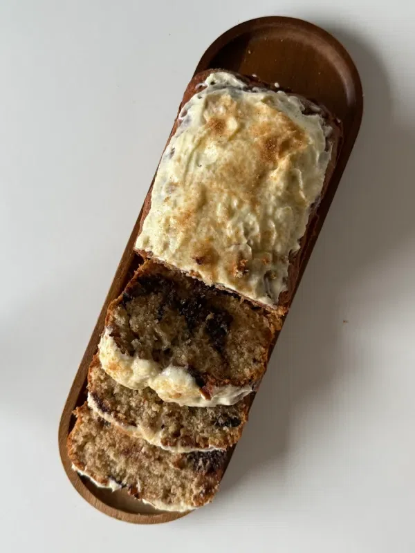 Cinnamon Roll Banana Bread with Cream Cheese Frosting cover